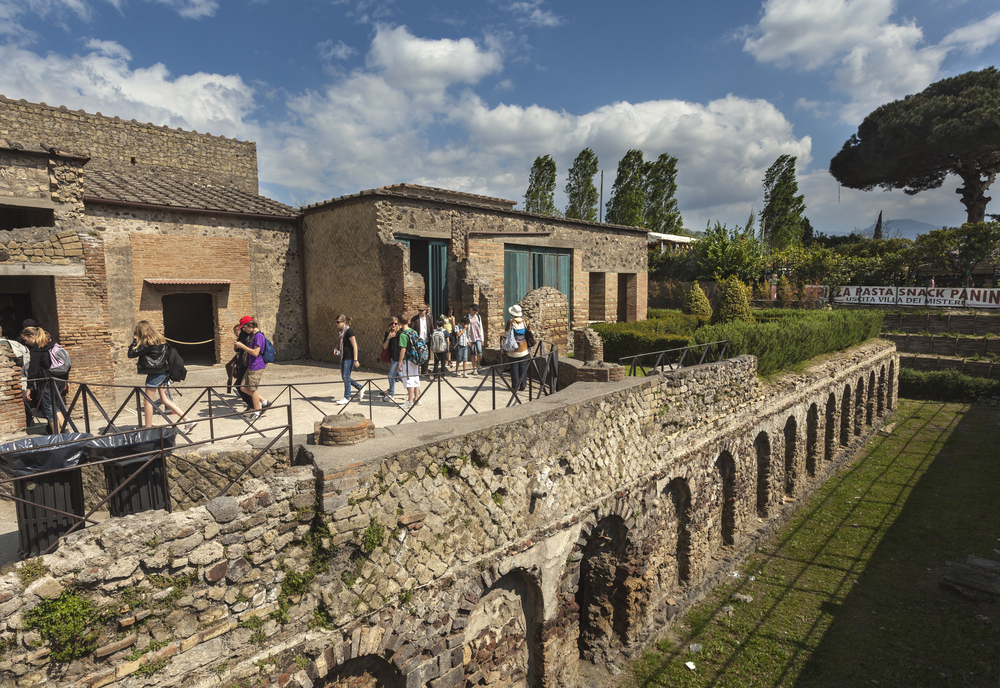 A traveler exploring ancient Roman ruins